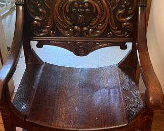 Incredible round oak chair with carved woman's head.