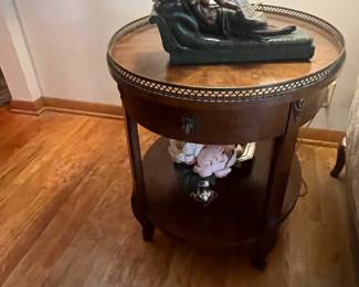 Pair of Henredon oval side tables, with brass gallery and ormolu.