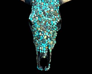 Turquoise covered cow skull