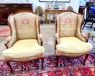 Pair vintage carved wing chairs