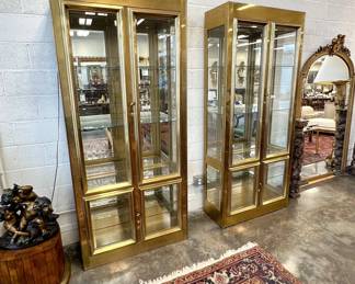 Pair of vintage Mastercraft lighted brass display cabinets by Bernard Rhône. These showcases are magnificent. Professional movers required to move these.