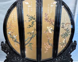 Highly carved round four panel Oriental screen inlaid with semi-precious stones
