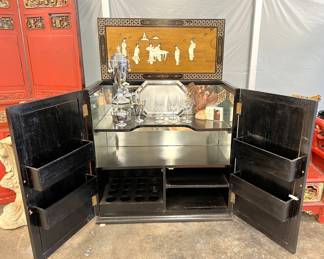 Mid-Century Oriental bar that closes to look like an Oriental chest. This is a very cool piece!