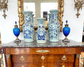 French Empire commode with marble top; French gilt beveled mirror; Sevres urns, Chinese vases