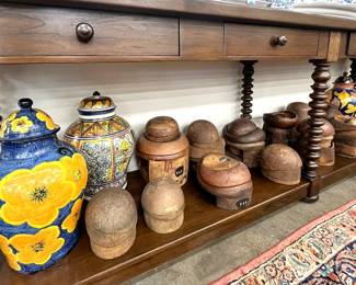 Collection of antique wooden hat forms; Talavera pottery urns