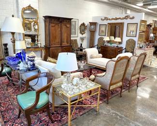 You need these gilt mirrored side tables and very large Oriental rug!