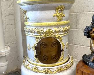 European glazed terra cotta stove with (3) round legs (legs aren’t pictured - they are inside stove)
