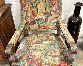Hand carved antique armchair with needlepoint upholstery