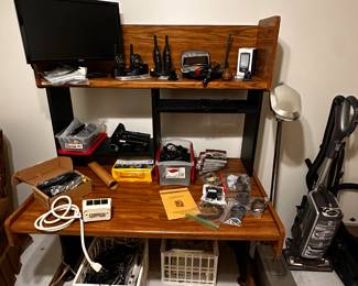 Great computer desk filled with office and computer supplies! 