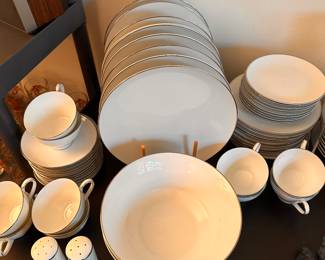Starting to unpack the many boxes and totes! Here is a lovely set of white SANGO china with sterling silver rims! 