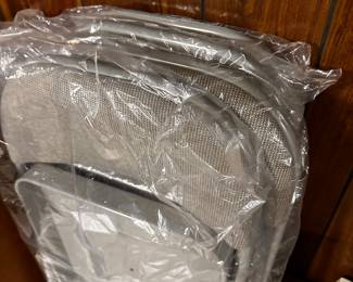 A set f four MINT NEVER USED Padded Folding Chairs!