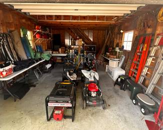 This is NOT the garage! This is the outbuilding! They are both PACKED with great items! Lots of camping - tents etc...