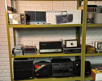 One of SEVERAL display racks filled with VINTAGE Stereos, radios, record players, speakers.... WE HAVE IT ALL! 