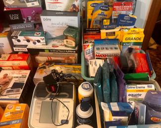 This is a table FILLED with excellent little measures for the home! The left side of the table is filled with small kitchen appliances interior original boxes, and the right side is filled with loads of medical, health & beauty and more! 