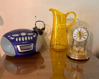 Lovely hand blown yellow glass pitcher, Sony CD/Radio Player, and a beautiful Bulova Anniversary clock! 