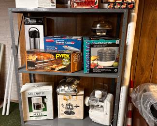 One of MANY display racks filled with new unopened  and gently used small kitchen appliances and accessories! 