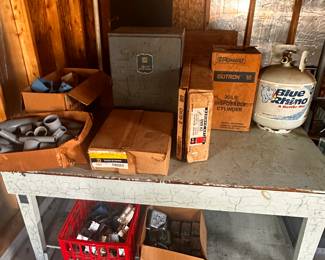 This entire table is filled with electrical gear! Fuse Boxes, plus, switches, holders, pipes... Also a pair of Propane tanks! The Table is for sale too! 
