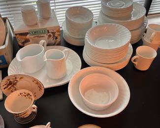 A huge set of white scalloped Corelle dishes! 