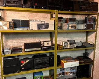 One of SEVERAL display racks filled with VINTAGE Stereos, radios, record players, speakers.... WE HAVE IT ALL! 