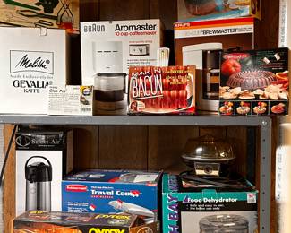 One of MANY display racks filled with new unopened  and gently used small kitchen appliances and accessories! 