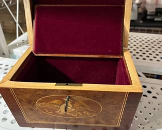 This and the next picture are of a very nice inlaid box with removable shelf, fully felt lined.
