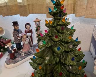 Carolers with a flickerlight lamp pot and a large internally lighted ceramic Christmas tree