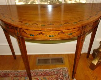 Pair of demilune tables with colorful inlay