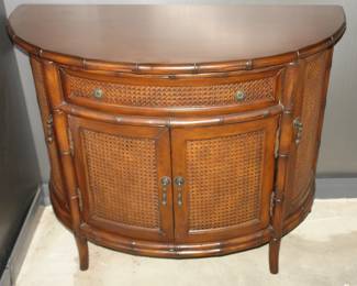 Bowfront cabinet with French cane door/drawer fronts 