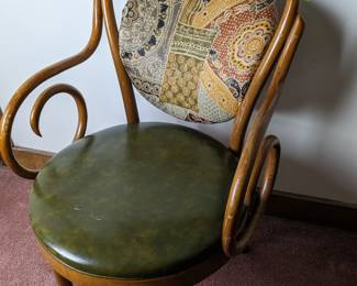 Lot 215: Bent wood chair with fabric back and Naugahyde seat; measures 35 " high

