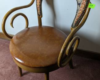 Lot 214: Bent wood chair with fabric back and Naugahyde seat; measures 32 " high