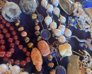 Walnut carved tigers eye and jade, baroque pearls- most strands fitted with 14 kt clasps and findings