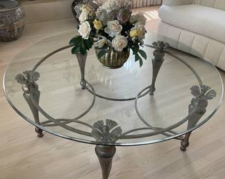 Round glass top coffee table, wooden legs, metal center 48" across the top, 20" tall  $300