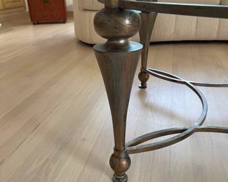 Round glass top coffee table, wooden legs, metal center 48" across the top, 20" tall  $300