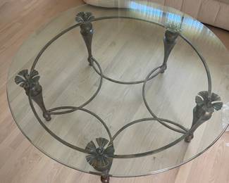 Round glass top coffee table, wooden legs, metal center 48" across the top, 20" tall  $300