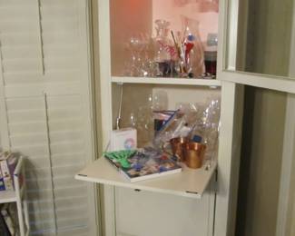 Great light-up bar or coffee bar, room at the bottom for a fridge