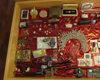Large selection of jewelry, military medals, unique pins, tie pins, necklaces, bolo ties, Fenton perfume bottle, watches, and more...