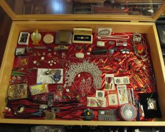 Large selection of jewelry, military medals, unique pins, tie pins, necklaces, bolo ties, Fenton perfume bottle, watches, and more...