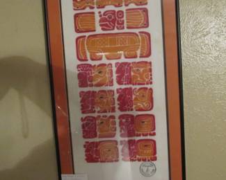 Framed art of the Mayan calendar done in wood block.