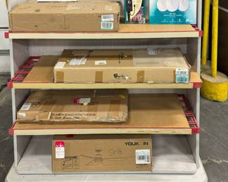 Random Amazon Packages on a Two-Sided Portable Shelving/Display Unit