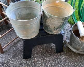 These Primitive pails have holes drilled in the bottom so would be great in garden 