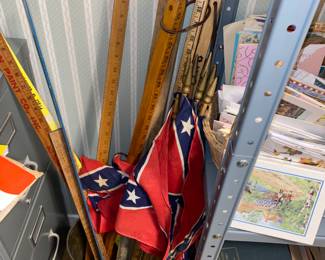 Ole Miss game day flags commemorate the scores of the games attended. Vintage yard sticks too