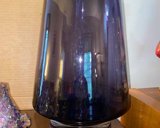 This picture is deceiving.This vase is over 12" tall and very heavy. The purple color is amazing