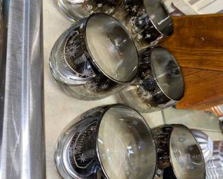 Check out these MCM silver metallic rolly Polly rock glasses with atomic details