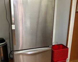 Whirlpool Stainless Steel refrigerator with large bottom freezer and ice maker. Clean and ice cold. Less than 2 year old.