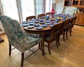 Gorgeous dining table , eight chairs & protective cover.