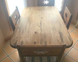 Wooden kitchen table with 4 chairs. Southwestern theme. 28 x 59 x 36