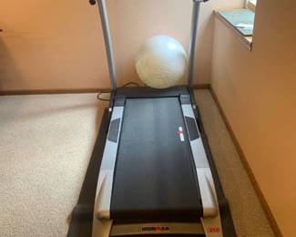 Ironman treadmill with exercise ball. Bring help to load. Located in the basement