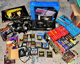 Nice group of vintage video game items!  Sega CD, Sega Genesis, Sega CD and Genesis games, Atari games, etc