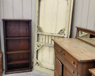 Ornate screen door, buffet,  and bookcase made from old crates.