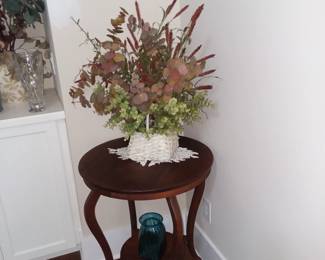 Round, vintage two-tier side table 